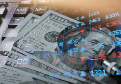 U.S. money and magnifying glass