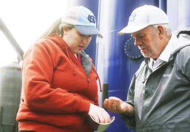 Caroline Lindley Looking At Grain At Lindley Mills