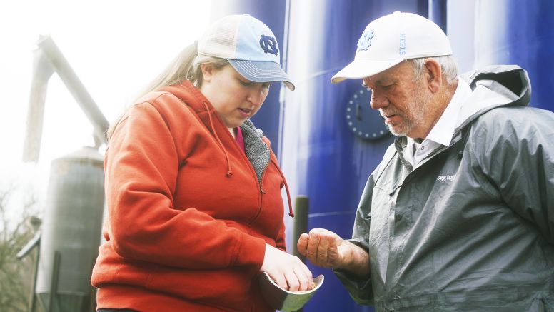 Caroline Lindley Looking At Grain At Lindley Mills