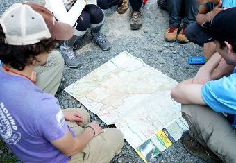 GLOBE students studying map