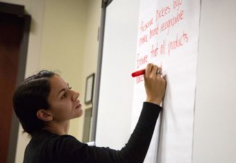 Student writing on whiteboard