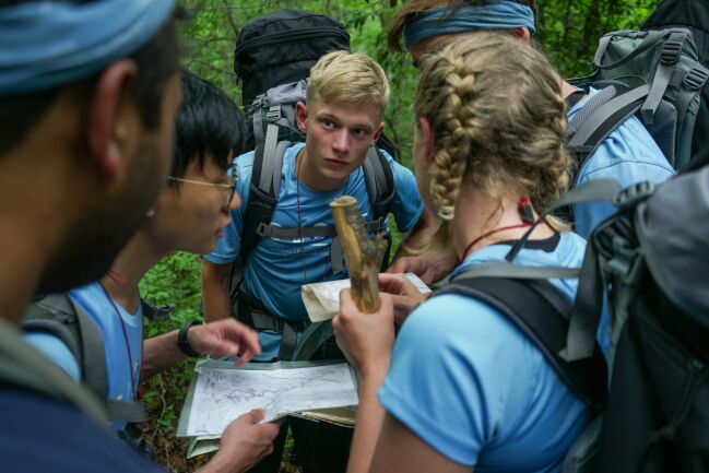 students looking at maps
