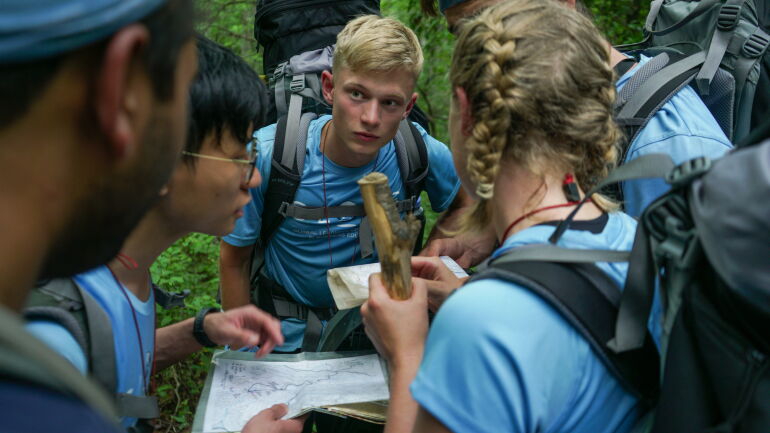 students looking at maps