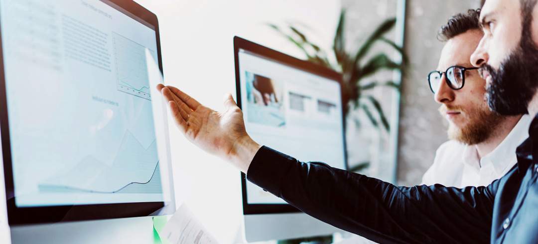 Men looking at screen