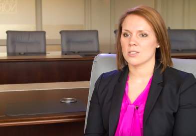 Leanne Fredericks talking in an empty conference room