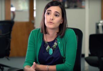 Woman talking, sitting in an office chair