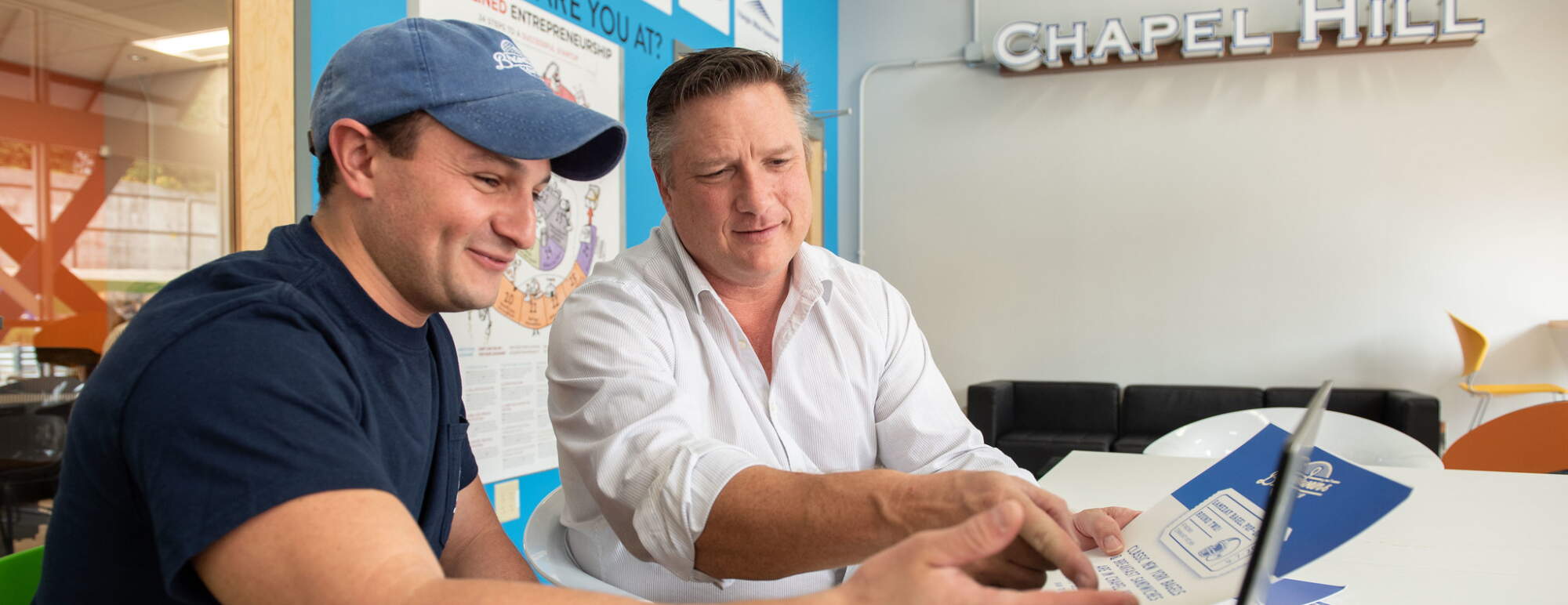 Student and professor reviewing business plan