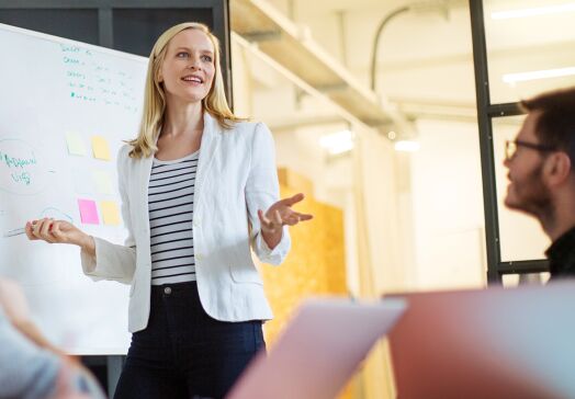 Woman presenting at meeting