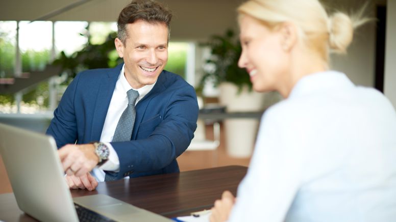Man and women discussing online course