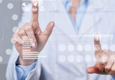 Person touching charts on a screen