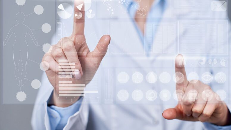 Person touching charts on a screen