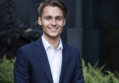 Øyvind Stenberg in suit and smiling at camera