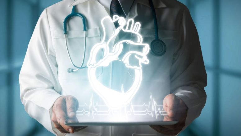 Doctor holding neon heart