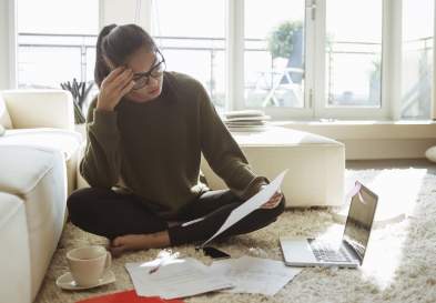 Young woman studying in her living room