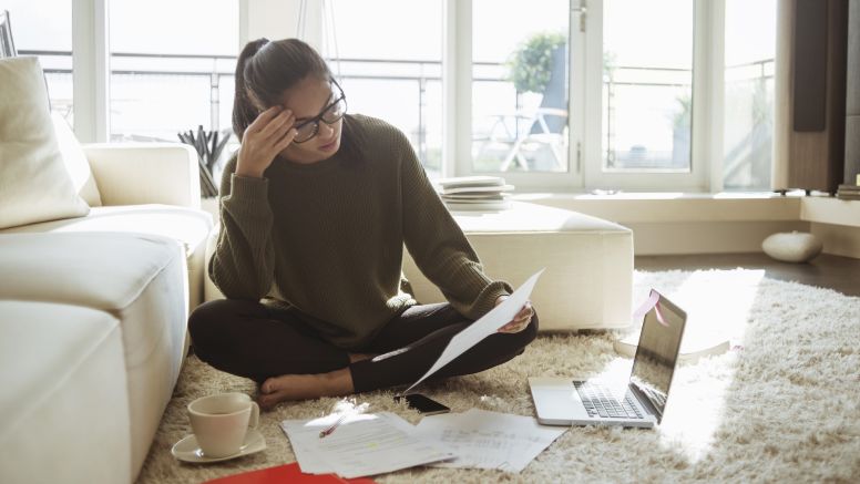 Young woman studying in her living room