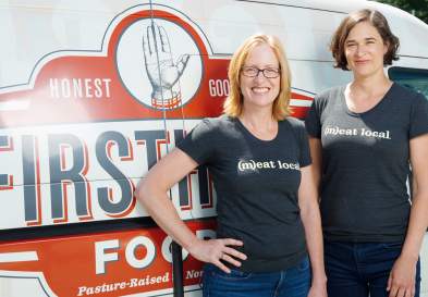 Jennifer Curtis and Tina Prevatte Levy of Firsthand Foods pose for a in front of a delivery truck