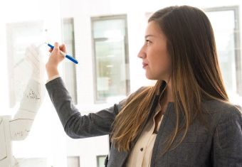 Woman at whiteboard