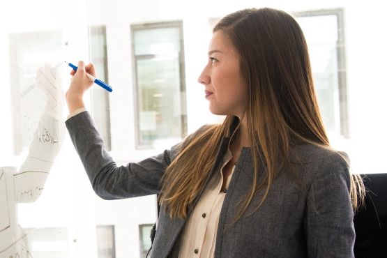 Woman at whiteboard