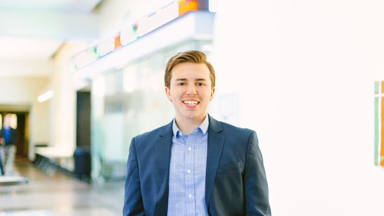 TJ Tucker Smiles Standing In UNC McColl Building