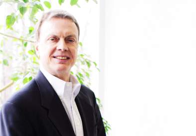 Steve Cumbie Standing In UNC Kenan-Flagler Hall