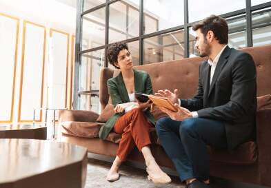 Businessman consulting woman coworker