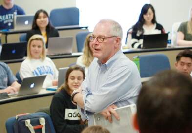 Full classroom with Nick Didow speaking to students
