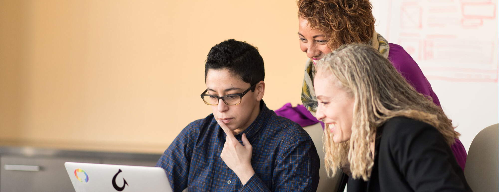 women look at a computer