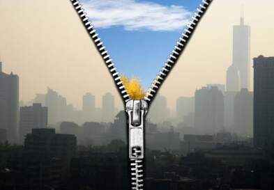 Zipper unzipping showing dirty city in front and clean air in back
