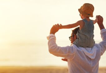 Dad with child on shoulders