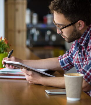 Woman on laptop choosing MBA recommenders