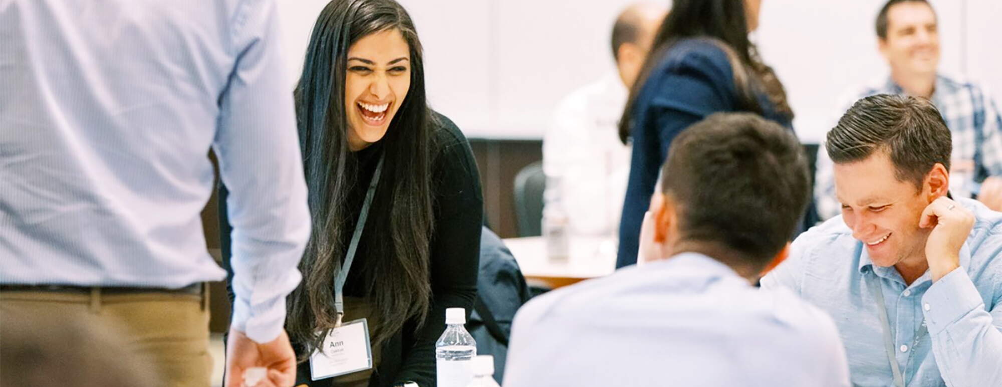 Students laughing at table