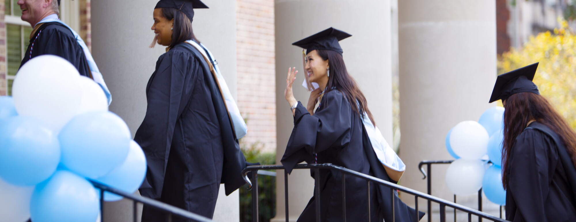 MBA students walking at graduation