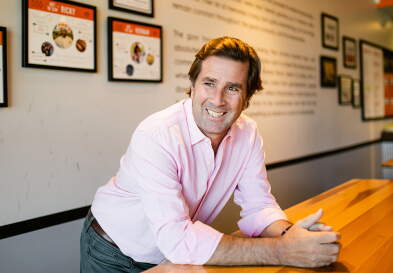 Hernan Moyano (MBA '02) inside the Durham location of Makus Empanadas.