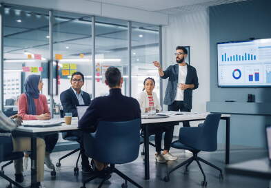 Businessman leads a meeting in a modern office.