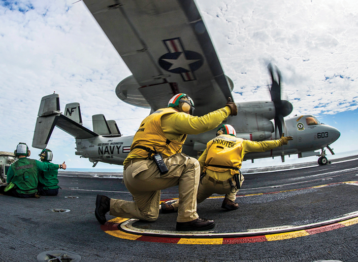 Navy plane and ground personnel.