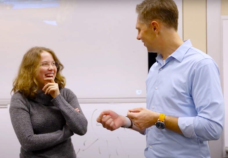 Professor Mike Christian with a student