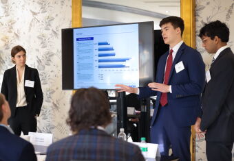 Students giving presentation at competition