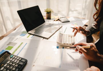 Two people work on taxes