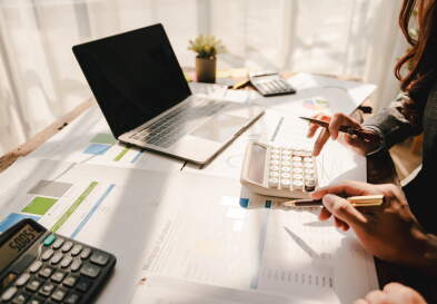 Two people work on taxes