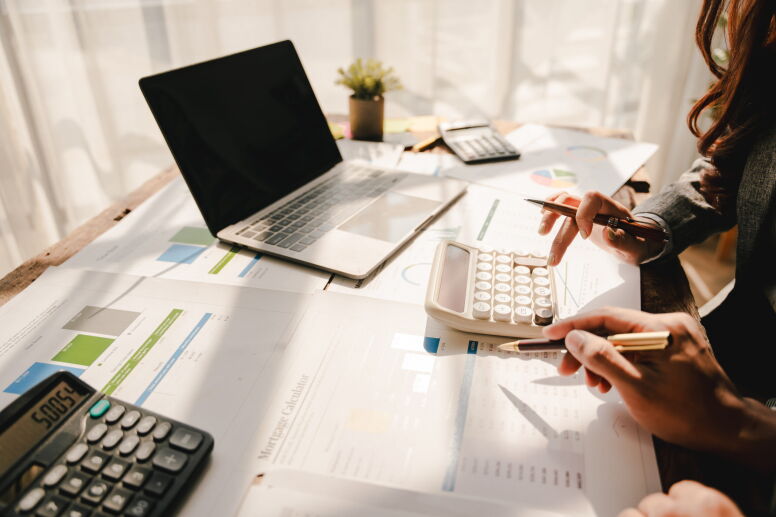 Two people work on taxes