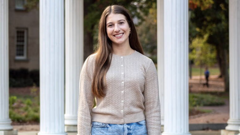 Elizabeth Kohn in front of the Old Well.