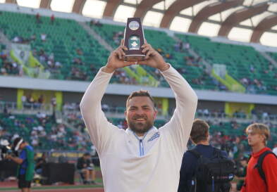 Tommy Kitchell (MAC ’25) holds his NCAA award.