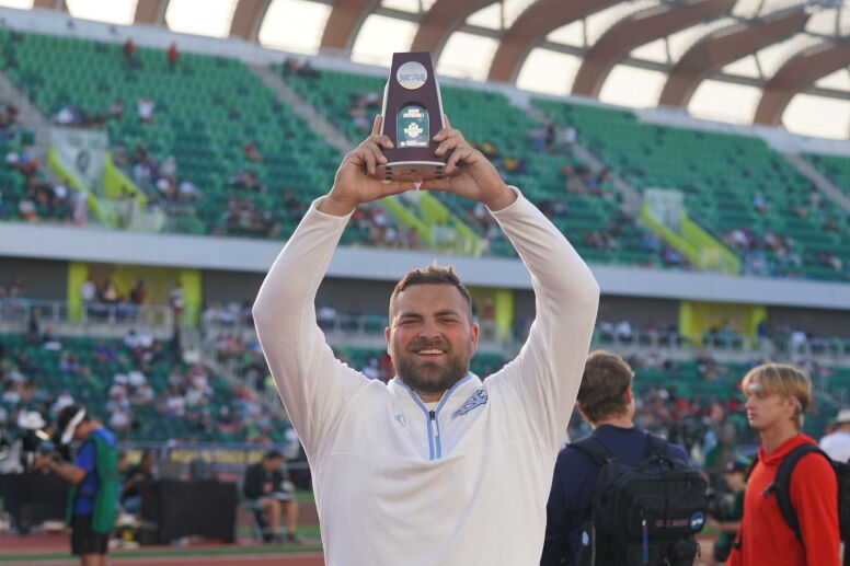 Tommy Kitchell (MAC ’25) holds his NCAA award.