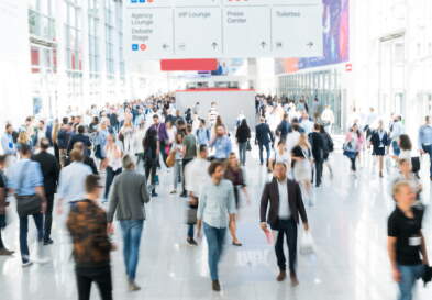A blurred large crowd at an airport.