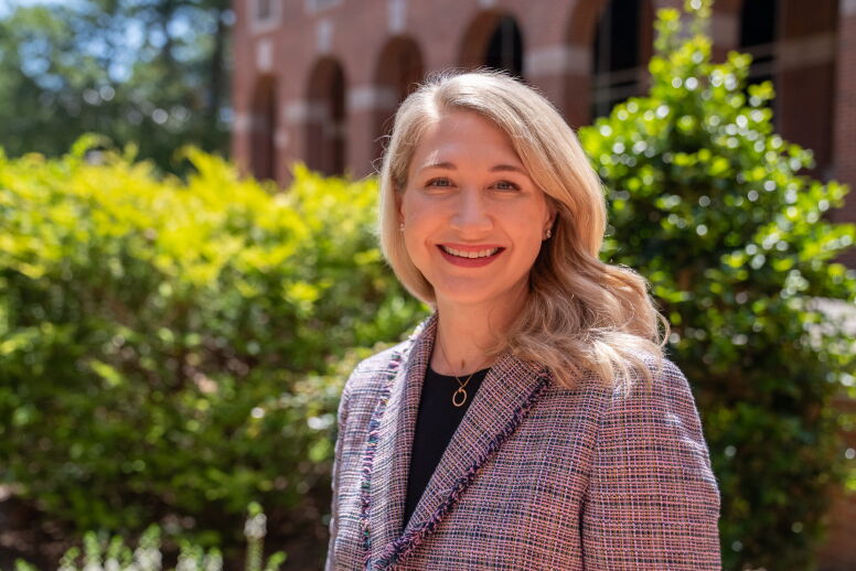 A headshot of Hillary Salo (BSBA ’02, MAC ’03) outside of McColl Building.