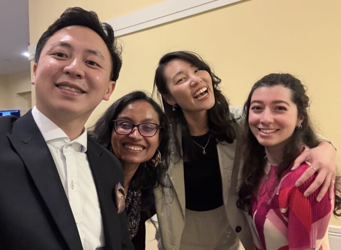4 Full-Time MBA students taking a selfie and smiling