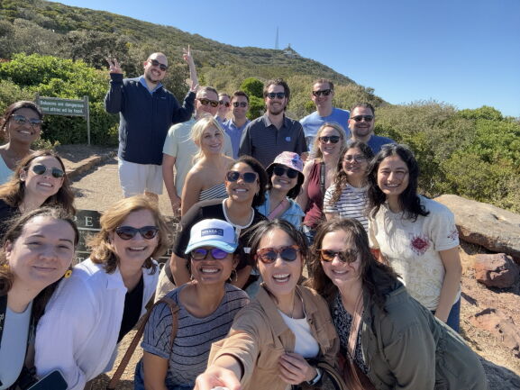A big group of students smiling at the camera on a global trip in South Africa