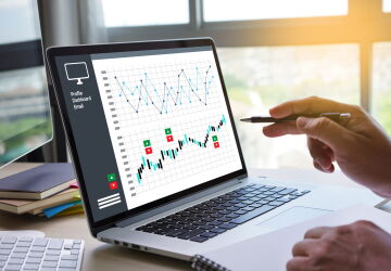 Computer with graphs on it.