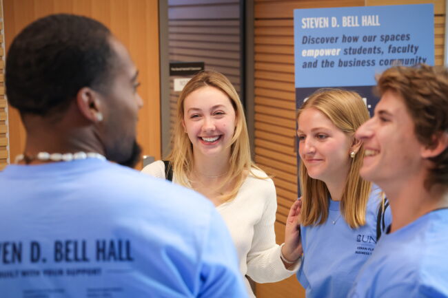 Students laugh at the grand opening celebration.