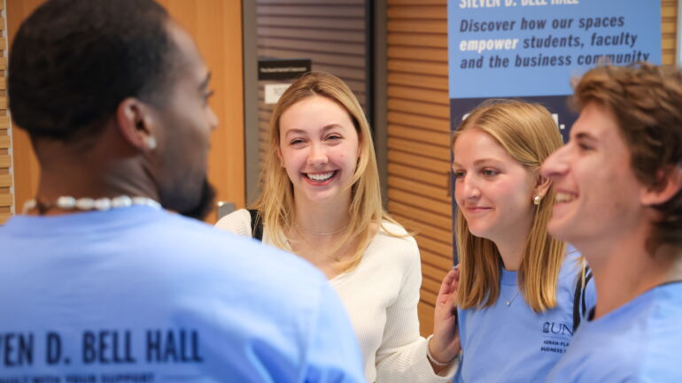 Students laugh at the grand opening celebration.